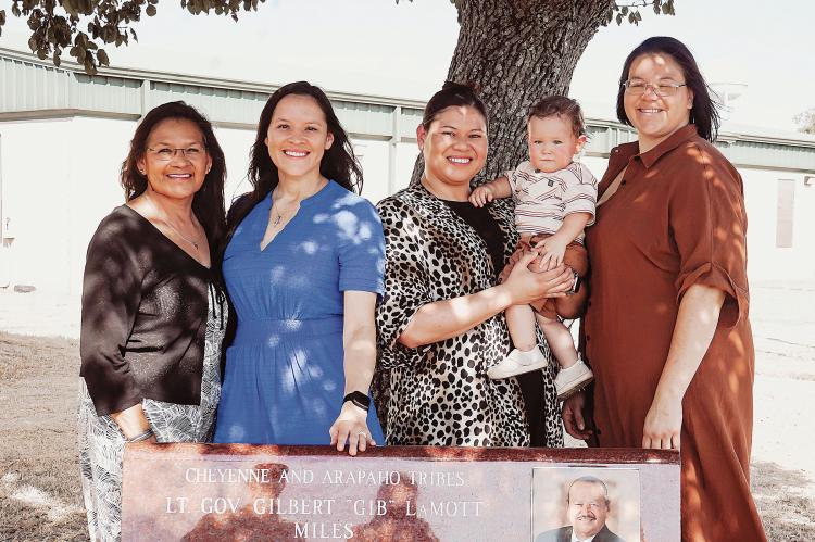 Gib Miles’ family stand behind his memorial bench