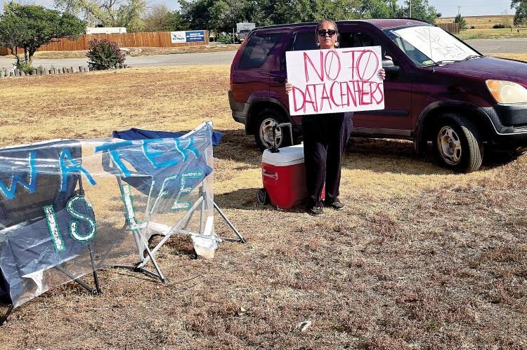 Sarah Pedro stands on the side of South Country Club Road