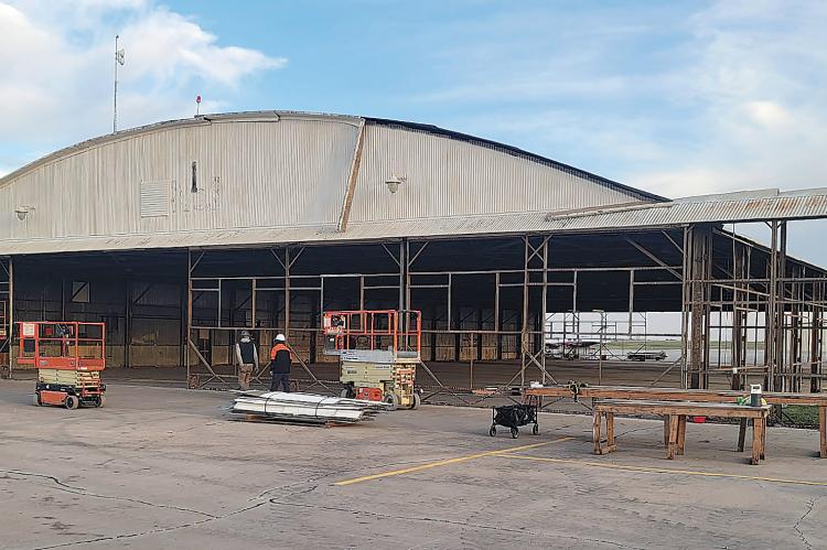 Crews are taking down an old hangar at El Reno Regional Airport