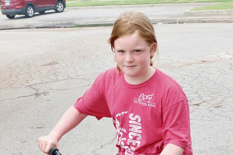 Ariona Arnold rode her bike to the park for her lunch bag