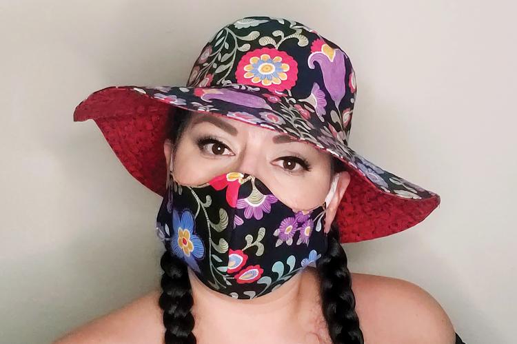 Nan Blassingame models her floral hat and mask combo