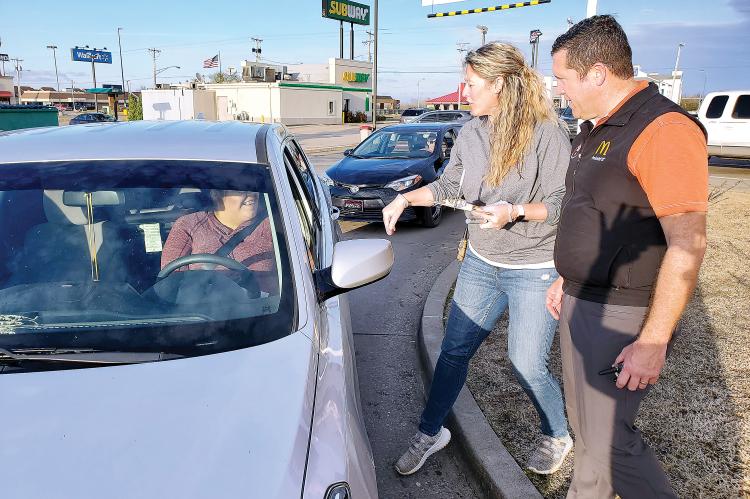 McDonald's owners Julie and Brian LaPat talk with a customer