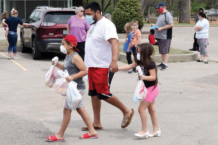 Many of those gathered for the ERPS food stop at Legion Park were wearing masks