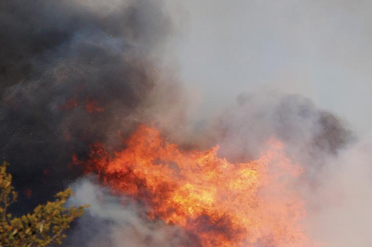 A 2022 grass fire near Calumet which burned hundred of acres of grassland and cedar trees