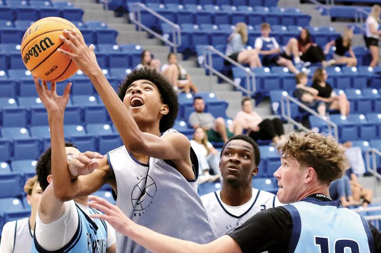 Mason Beartrack gets fouled while taking the ball to the basket