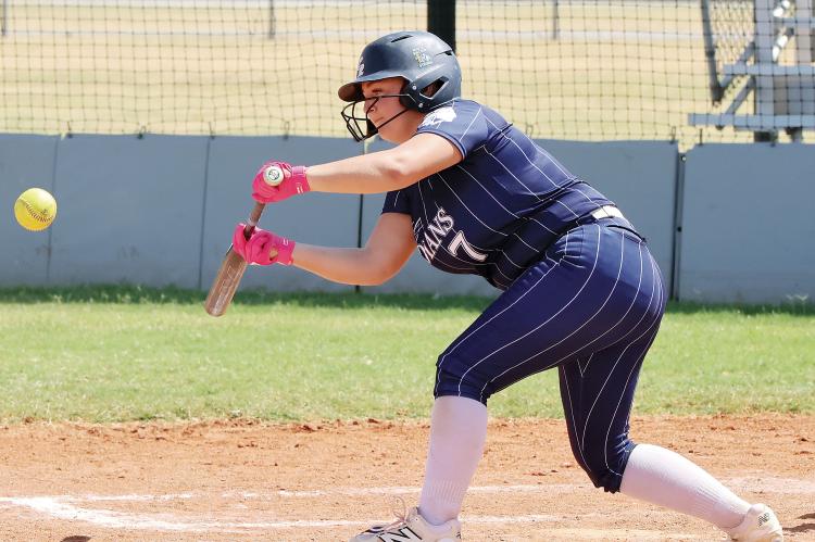 Daisy Hall (7) drops down a bunt in the Indians win over Bishop McGuinness