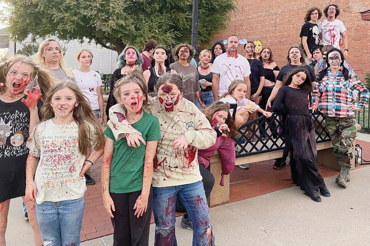 A cast photo of some of the characters from the 2025 Haunted Trolley