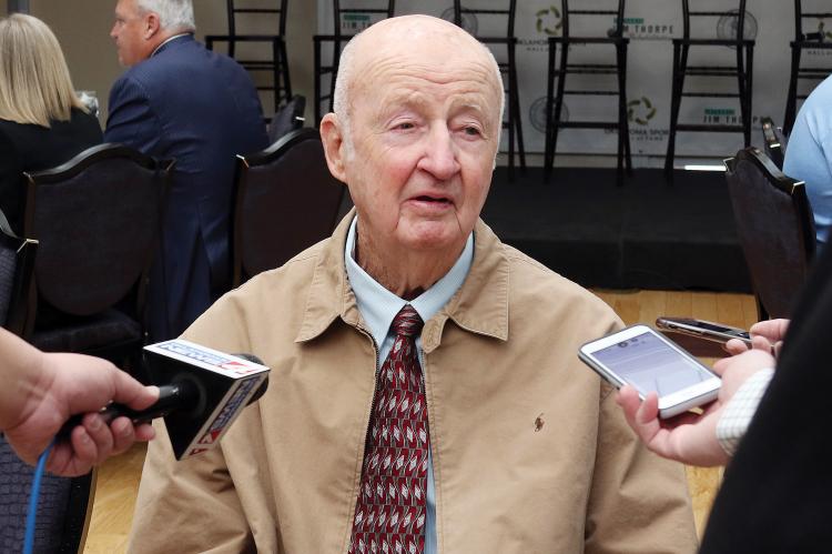 Reed speaks with reporters
