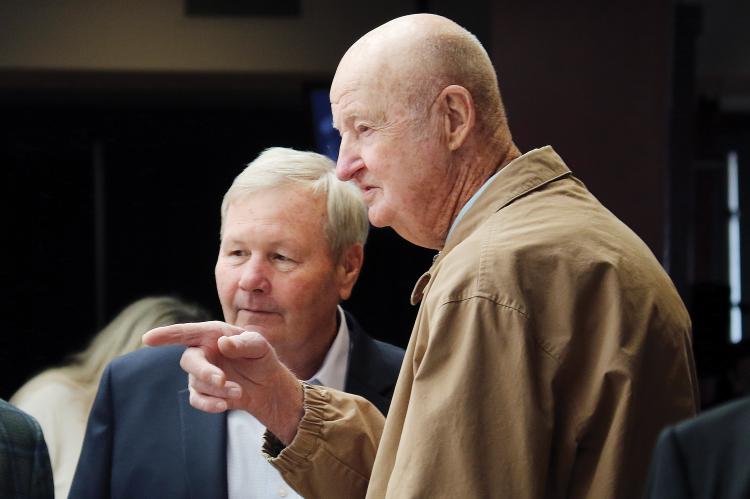 Hub Reed points someone in the crowd to Bill Reeves