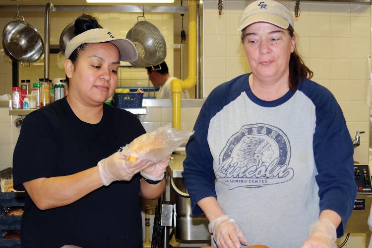 ERPS cafeteria workers Rosas and Bechtel sack up sandwiches