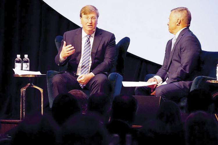Tate Reeves, left, with Chad Warmington