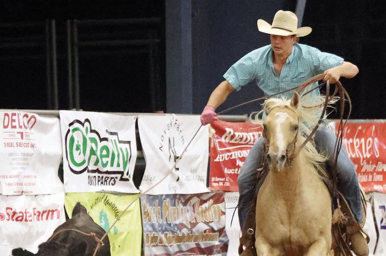 Kal LaFoe throws his rope over the head of a calf