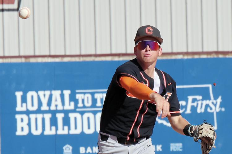 Kingston Arnold makes a throw toward first on a double play attempt