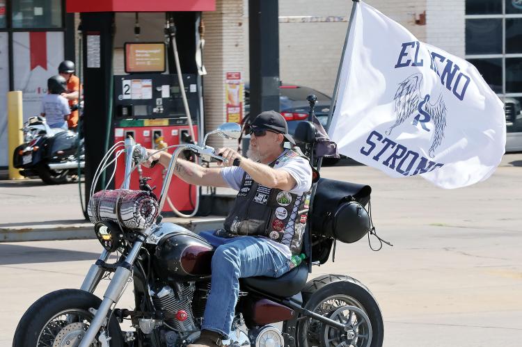 Matthew Wickware rides his motorcycle down Sunset toward the starting point