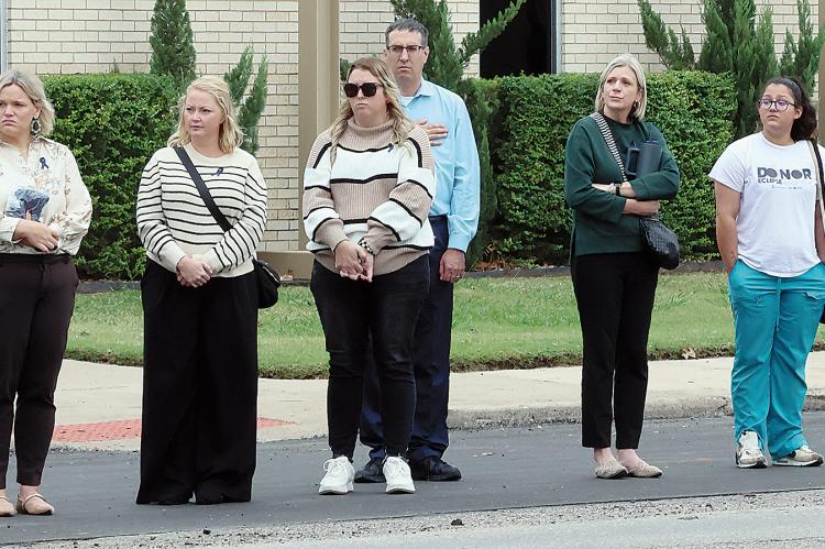 El Reno city staff watches from outside City Hall