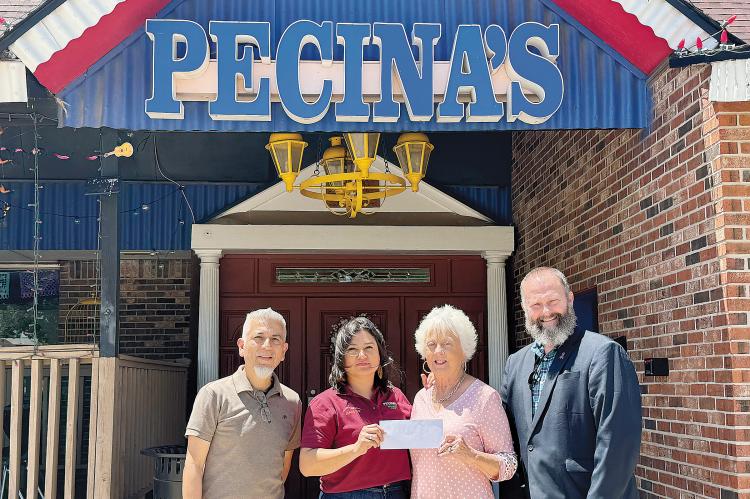 Left to right, Javier and Rosalina Pecina along with Carolyn Husmann and Matt Whetzel