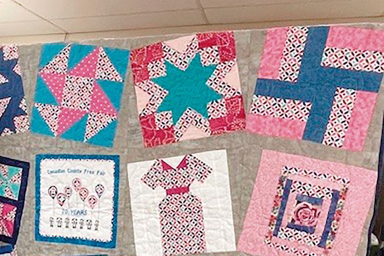 A quilt made up of blocks from a previous Canadian County Free Fair