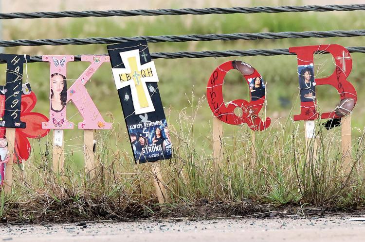 One of several roadside memorials at the collision site