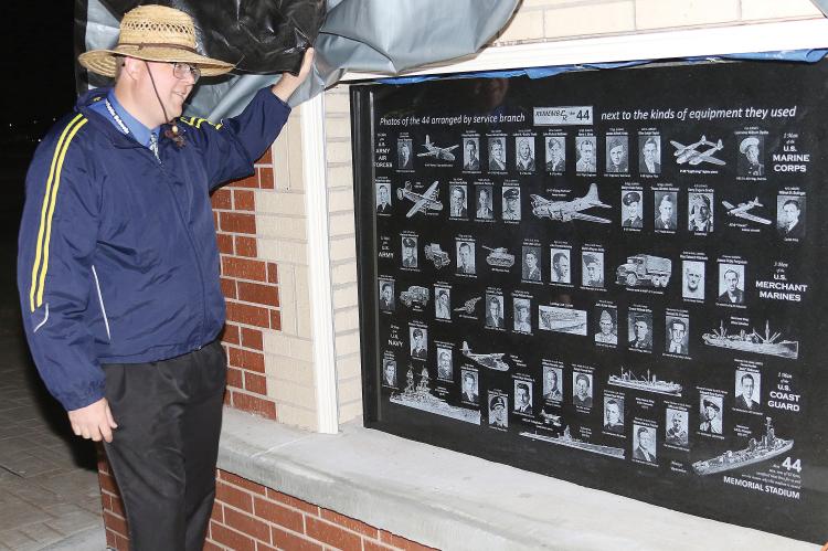 Brian Rukes with monument