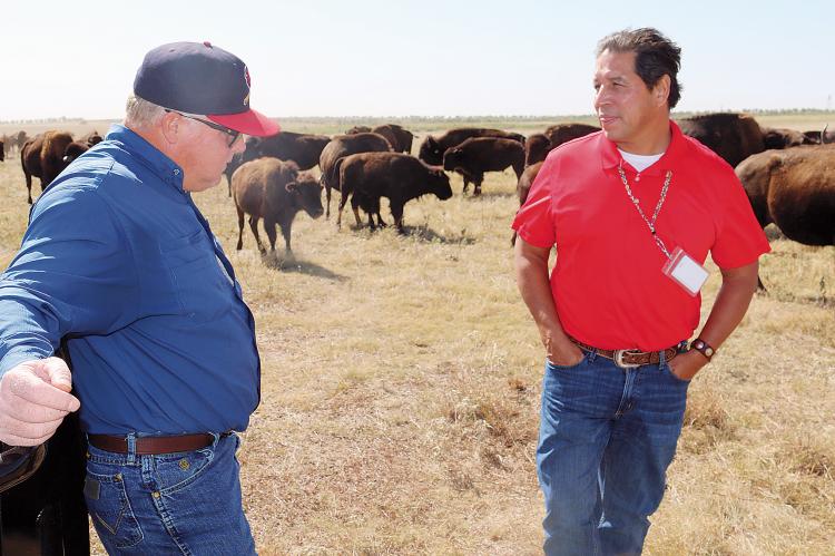 Ryan Long, left, and Tony Maldonado talk research