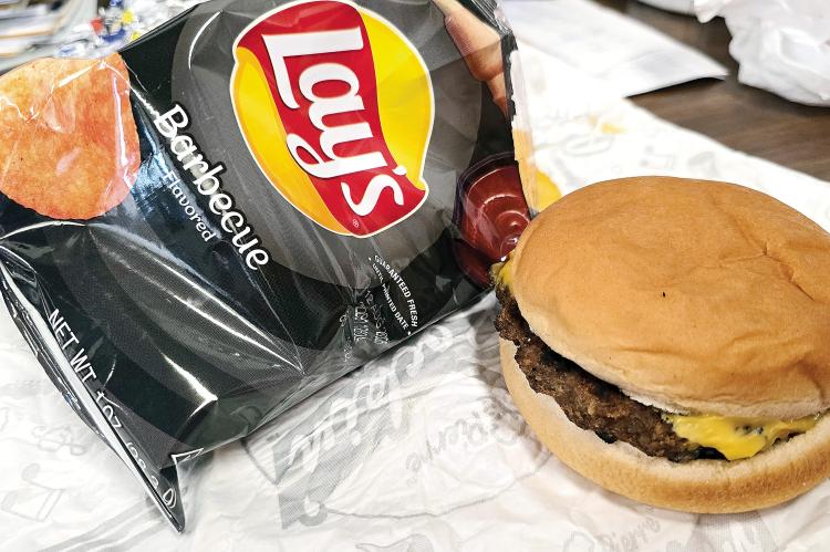 A bag of chips and a cheeseburger which was part of a meal being served to local children during ERPS summer food service