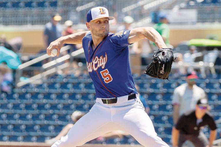 Cameron Hill strides into a pitch during
