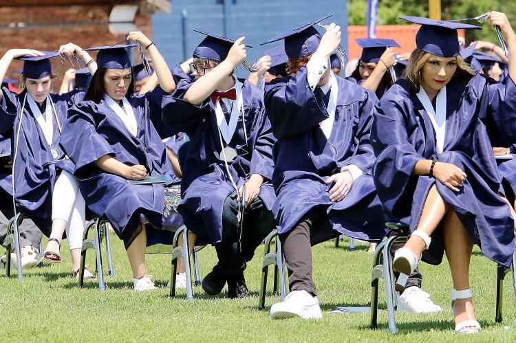 Members of the Class of 2020 switch their hat tassels