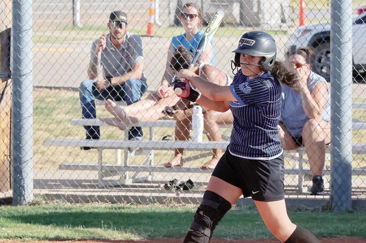  Reyna Mendoza slaps the ball down the third-base line