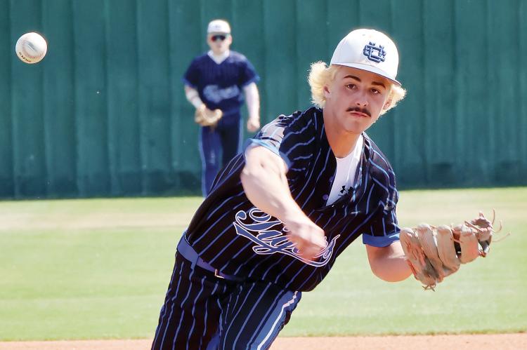 Blake Bailey watches a pitch fly toward the plate