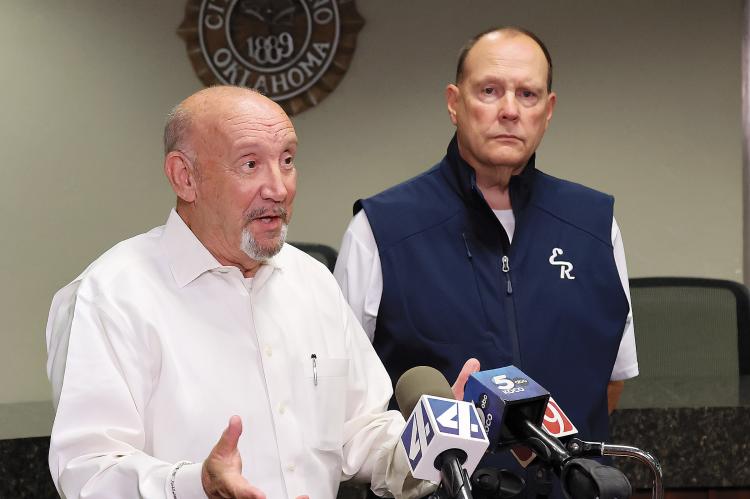 Ken Brown (left) gives an update on the city’s water issues while Superintendent Matt Goucher, spoke on the district’s closure