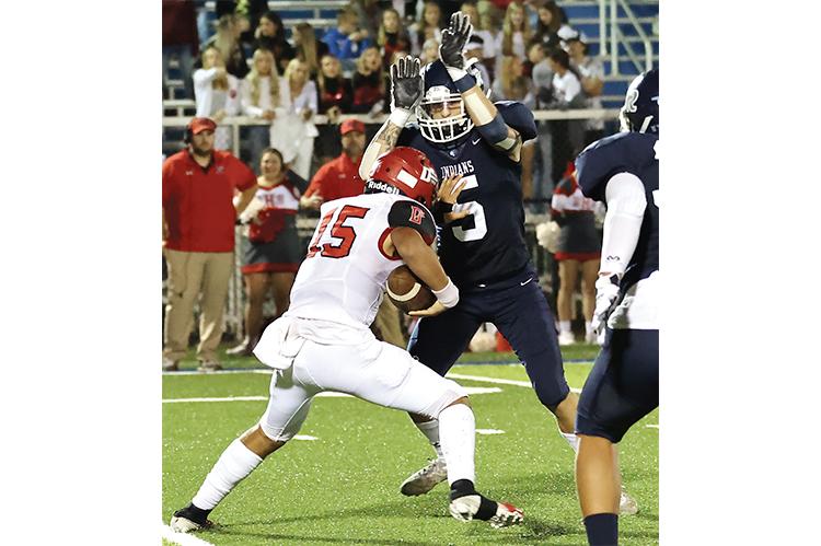 Xzavier Devereaux closes in on a Duncan ball carrier for a tackle behind the line of scrimmage.
