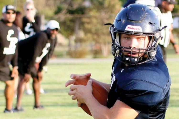 El Reno’s passing game had bright spots in the scrimmage with Clinton. Kord LaFoe turns upfield after catching a swing pass out of the backfield.