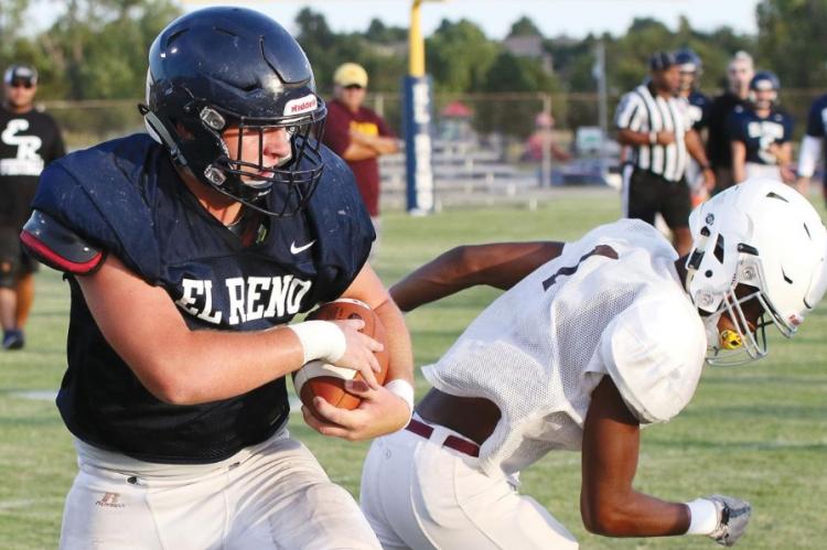 Kolton Hunt plows through a defender en route to a 15-yard gain.