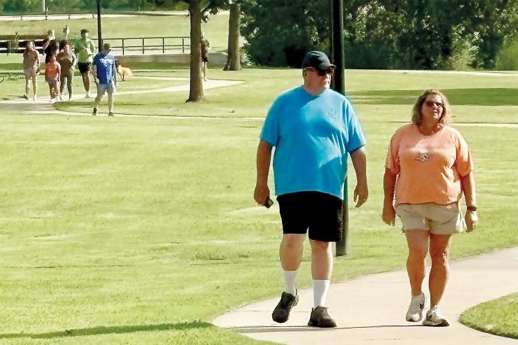 Guests of the ribbon-cutting walk and jog along the trail
