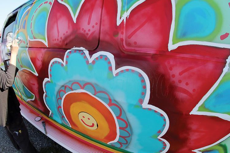 Local artist Sue Bear painted a mural on a van for a summer youth camp.