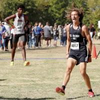 Ethan Brooks reacts to outkicking a Guymon runner to the finish line