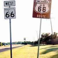 Signs along westbound State Highway 66 near the John Kilpatrick Turnpike