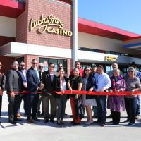 Reggie Wassana and Hershel Gorham cut the ribbon, officially recognizing the grand opening