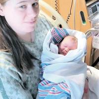 Nevada McElfresh holds her second child, Jupiter Scott