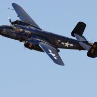 The B-29 Devil Dog flies over the El Reno Municipal Airport