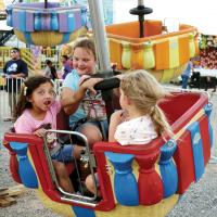 Local children react to one of the rides during the 2022 Canadian County Free Fair