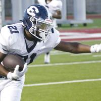 Xzavier Karty stiff-arms a Weatherford tackler after catching a short pass