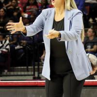 Jennifer Douglas shouts out instructions to her players in the 5A state championship game