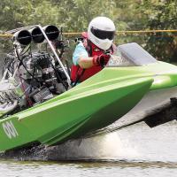 Smokey Freeman tries to keep the nose of his boat from sailing off the starting line