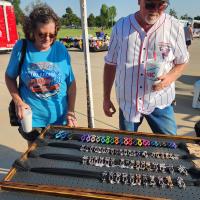 Gayla and Tom Hays of Meeker look at jewelry from a vendor