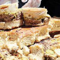 Slices of the Big Burger wait to be served.