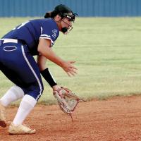 Taylor Acosta slides to her left to field a grounder