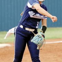 Zoey Pawnee makes a throw toward first base after fielding a grounder