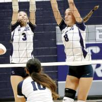Jillian Reavis (3) and Brantlie Charmasson (8) combine for a double block attempt