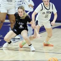 Halli Ferguson grabs the arm of a Guthrie player 
